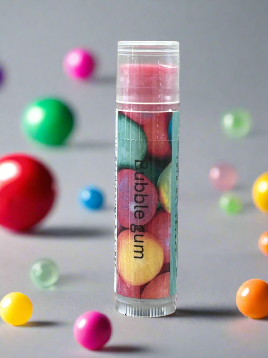 Bubble gum container with colorful gumballs on a gray background